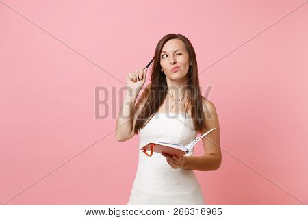 Pensive Bride Woman In Wedding Dress Searching Ideas For Planning Wedding, Writing Notes In Diary, N