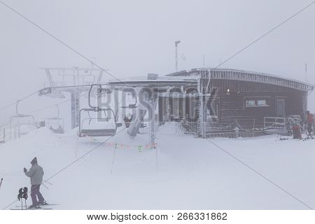 Snowbound Chair Lift In The Mist At A Ski Resort. Skiing. Winter In The Mountains. Tatra Mountains. 