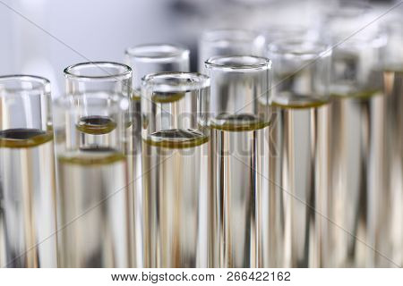 Yellow Liquid Spilled Petrol Additive Innovative Supply In Glass Tube. Conveyor Line Production Hous