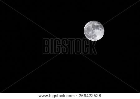 Full Moon Over Dark Black Sky Background At Night. Lunar Perigee Super Moon. Largest Apparent Size O