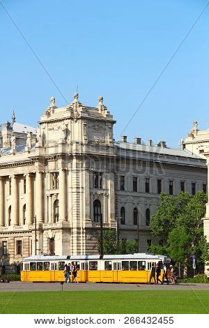 Budapest, Hungary - May 5, 2018: Old Yellow Tram Near Ethnographic Museum On Kossuth Lajos Ter (squa