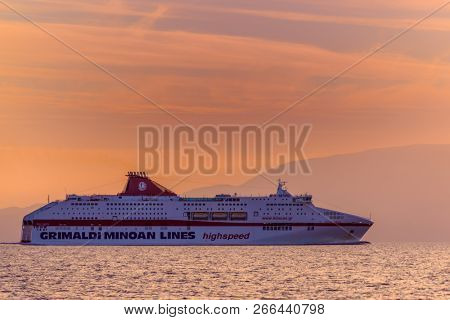 KEFALONIA, GREECE - OCTOBER 22, 2018: Minoan Lines High Speed Ferry Cruise Europa passing Kefalonia island at sunset