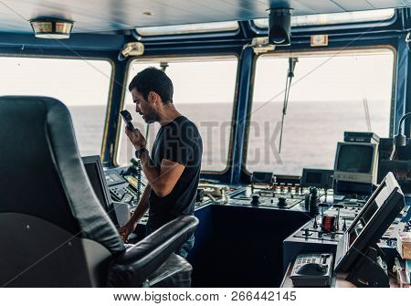 Marine Navigational Officer Is Reporting By Vhf Radio
