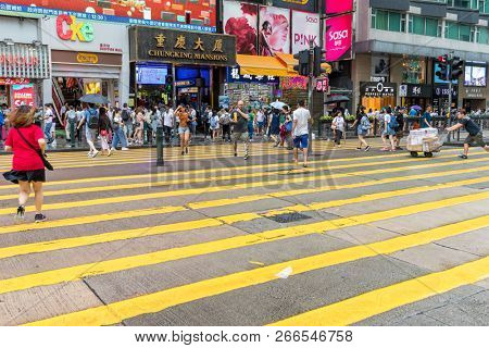 Tsim Sha Tsui, Hong Kong 17 August 2018:- People cross the street