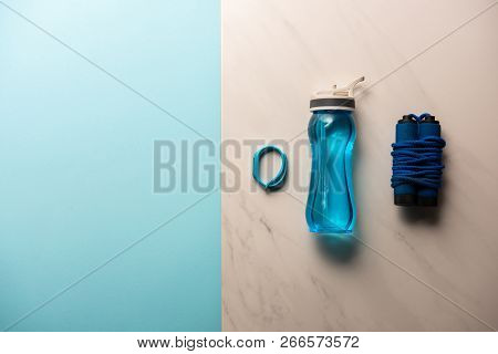 Elevated View Of Arranged Sport Equimpent On Marble And Blue, Minimalistic Concept