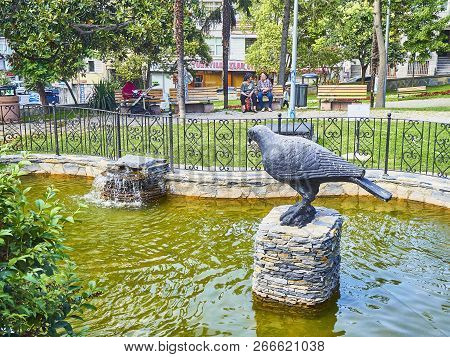 Istanbul, Turkey - July 9, 2018. A Crow On A Bench Of Dogancilar Park. Uskudar. Istanbul, Turkey.