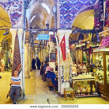 Istanbul, Turkey - July 11, 2018. Vendor At The Passageways Of The Kapali Carsi, The Grand Bazaar Of