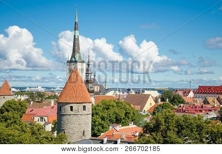 Panoramic View Of Old Town Of Tallinn With Traditional Red Tile Roofs, Medieval Churches, Towers And