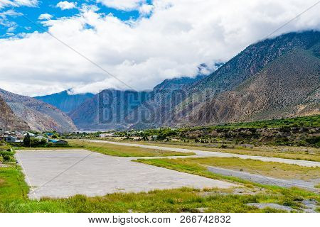 The Airfield Track Of Jomsom Airport With Annapurna Peaks In The Background