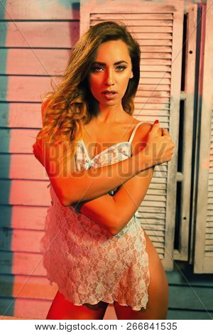 Attractive Young Woman With Sensual Athletic Body Standing Hugging Herself In Transparent Lace Chemi