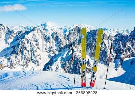 Ski in winter season, mountains and ski touring backcountry equipments on the top of snowy mountains in sunny day, Verbier Switzerland.