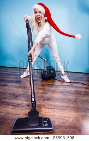 Woman Vacuuming The House, Last Minute. Teen Girl In Santa Helper Hat With Vacuum Cleaner, Angry Fur