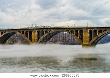 Francis Scott Key Bridge Across Potomac River, Winter Fog On The Water.