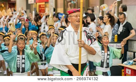 Tokyo, Japan - August 2018: Japanese Performers Dancing Traditional Awaodori Dance In The Famous Koe