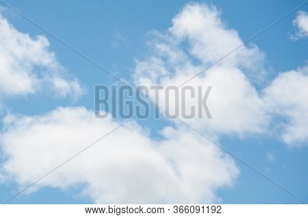 White Cumulus Clouds In Sky In Nature Image Great For Backgrounds And Texture.  This Cloudscape Beau