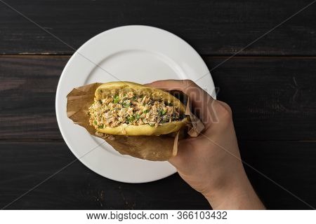 In The Hand Of Rou Jia Mo, This Chinese Hamburger Is A Popular Street Food. On A Photo A Sandwich In