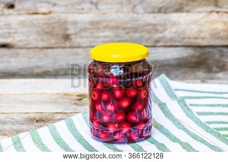 Glass Jar With Canned Cherries Fruits. Preserved Fruits Concept, Canned Fruits Compote Isolated In A