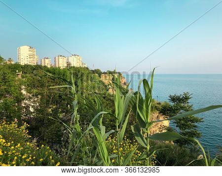 Beautiful Buildings, Green Rocks And Mediterranean Sea View In Antalya, Turkey. Horizontal Stock Ima