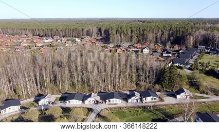 Aerial View Of The Lake Borisovskoye, The Forest And The Settlement In Autumn Day, Borisovo, Leningr