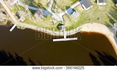 Aerial View Of The Lake Borisovskoye, The Forest And The Settlement In Autumn Day, Borisovo, Leningr