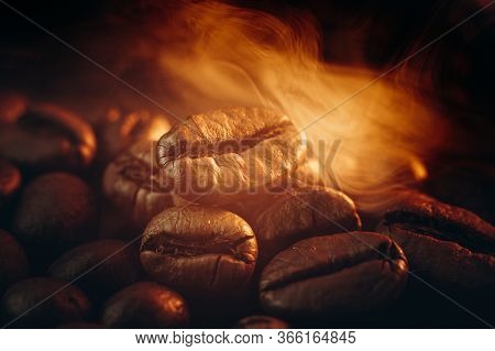 Coffee Beans On The Table Fried With Steam And Hot Close-up