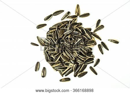 Sunflower Seeds Isolated Group With Top View On White Background And Clipping Path.