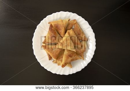 Famous Traditional Arabic, Middle East, Asian Cuisine. Triangular Arabic Chicken Samosa On Dark Wood