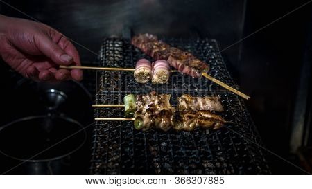 Chef Cooking Inside Izakaya Japanese Bar In Tokyo. Japan Food