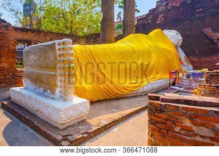 Lying Buddha Dressed In Yellow Scarf In Temple Wat Yai Chai Mongkol Near Ayutthaya