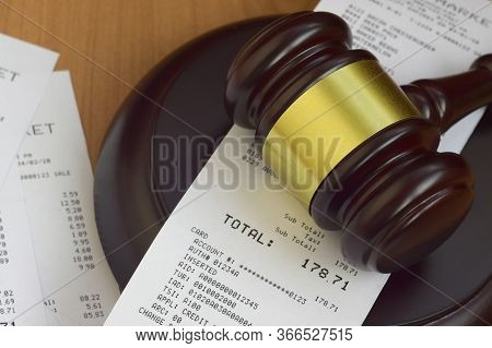 Justice Mallet And Many Supermarket Receipts On Wooden Table
