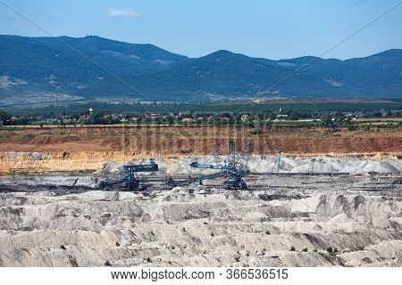 Brown Coal Open Pit Landscape With Enormous Digging Excavator In Matra Mine Hungary, East Of Budapes