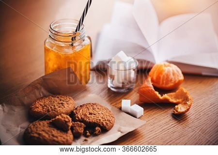On The Wooden Table Is Breakfast - A Mug With Sea Buckthorn Morse, Peeled Tangerine, Oatmeal Sweet C