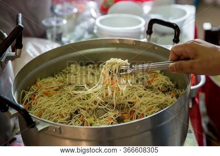 Chinese Food Fried Noodles. Singapore-style Noodles, Roasted Pork And Rice Noodles Stir Frying. Rice