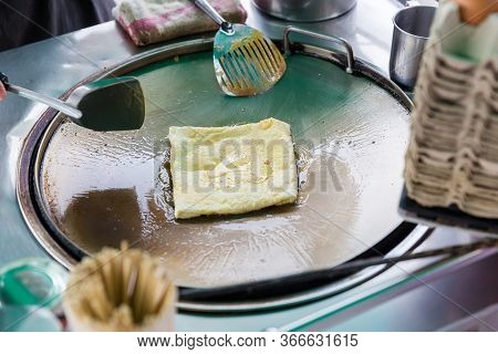 Roti Making, Roti Thresh Flour By Roti Maker With Oil. Indian Traditional Street Food. Thai Pancake 
