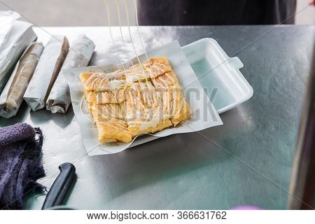 Roti Making, Roti Thresh Flour By Roti Maker With Oil. Indian Traditional Street Food. Thai Pancake 