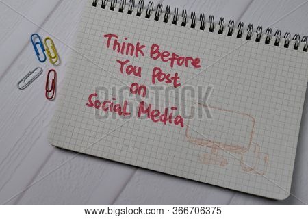 Think Before You Post On Social Media Write On A Book Isolated On Wooden Table.