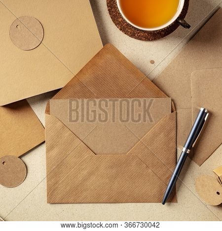 An Assortment Of Brown Kraft Papers, With An Envelope, A Greeting Card, A Notebook, A Label, Overhea