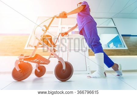 Patient On Rollator With Hand Brakes Moving In Hospital