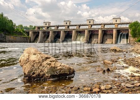 Big Stone On The River Front Plan, Rear Plan, The Floodgates Of The Dam And Cloudy Sky Summertime. R