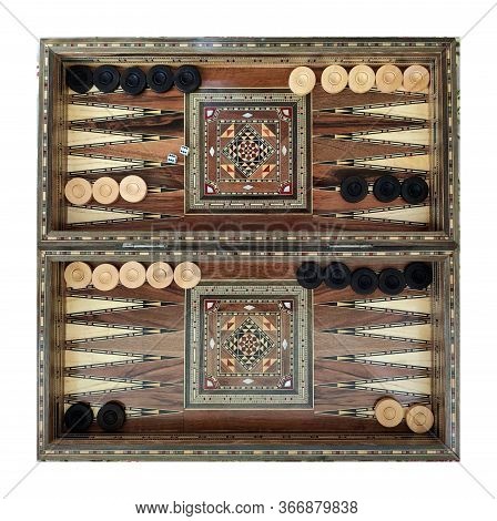 Backgammon With Wooden Inlay. Wooden Backgammon Board Game Of Pearl Inlaid On Brown Background.