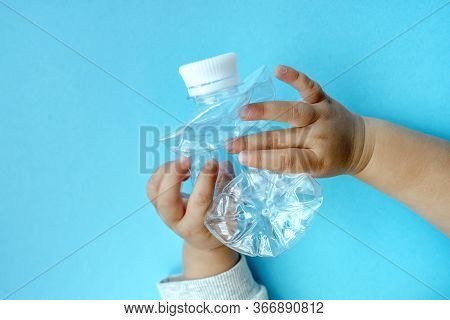 Transparent Plastic Bottle On A Solid Blue Background For Recycle Waste. Waste Separation Concept.pr