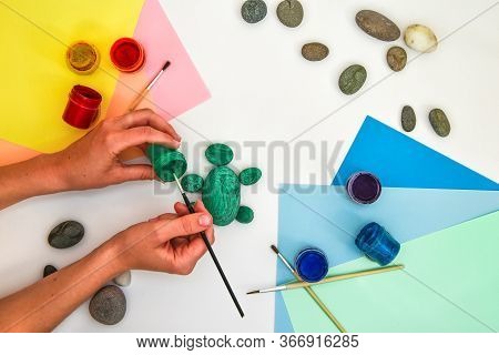 Painting A Rock Green Turtle On A Stone Step By Step. Children Art Project. Diy Concept. Step By Ste