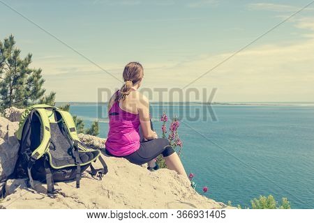 Active Woman Sitting And Enjoying Sea View. Living Life And Meditating.