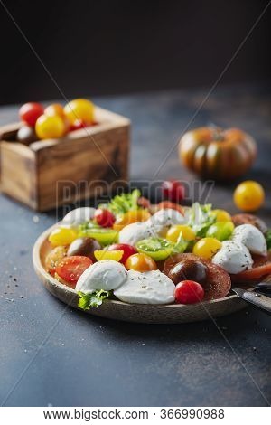 Healthy Salad With Mozzarella, Colored Tomatoes And Origan, Selective Focus Image