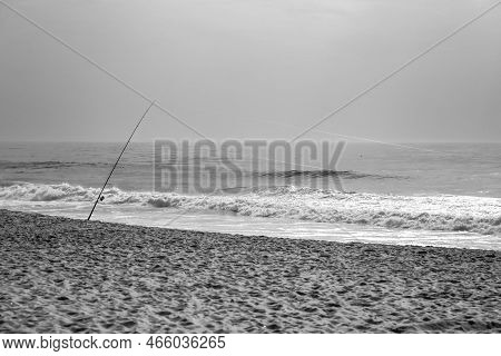 Fishing Rods On The Shore On A Cloudy Day On Comporta Beach In Portugal