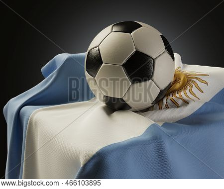 A Regular Soccer Balls Resting On An Argentina Flag Draped Over A Plinth On An Isolated Studio Backg