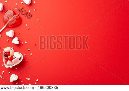 Valentine's Day Celebration Concept. Top View Photo Of Heart Shaped Saucer With Jelly Candies Lollip
