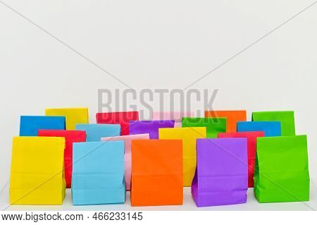 Set Of Colorful Shopping Folded Paper Bags On White Background. Paper Shopping Bags Mockup, Blank Re