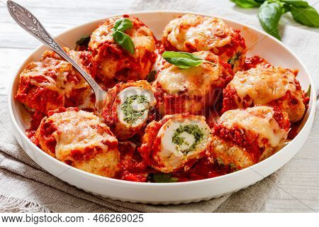 Chicken Rollatini With Spinach Ricotta Filling In Marinara Sauce Topped With Mozzarella Cheese And F