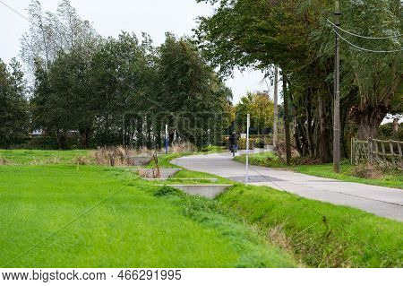 Laarne, East Flemish Region, Belgium, 11 03 2022 - Green Surroundings And A Biking Trail At The Flem